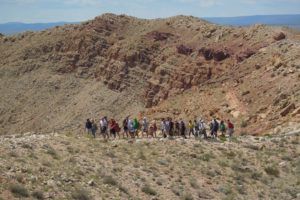 Tourists walking a guided tour of Meteor Crater